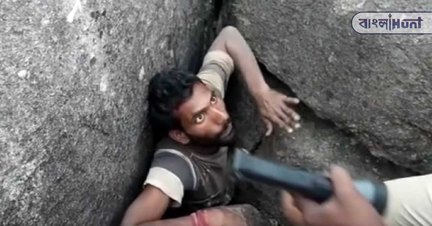 man stuck in cave
